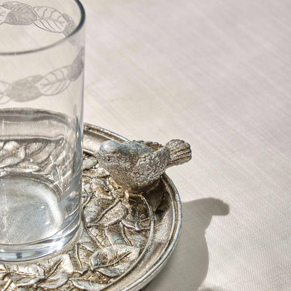 SPARROW - WATER SET SILVERBring elegance to your table with the "Sparrow" Water Set in a timeless silver finish. This exquisite set features a delicately engraved glass and an intricately desCUP AND SAUCER
