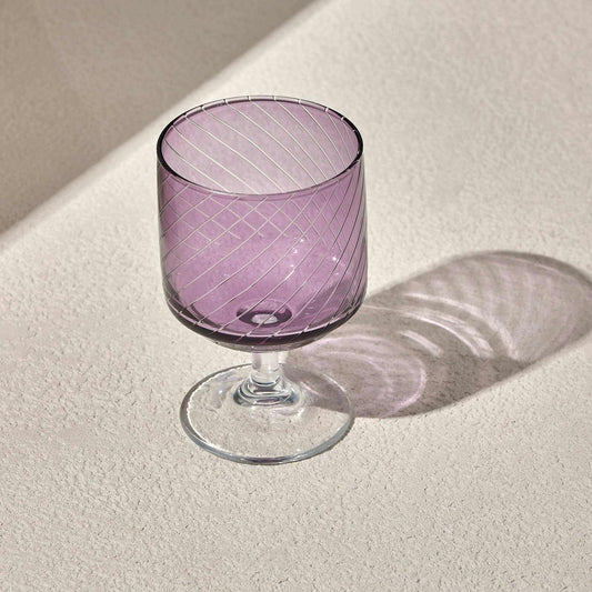 LAL WINE GLASS - PURPLE with diagonal stripes and clear stem, perfect for enhancing table settings.