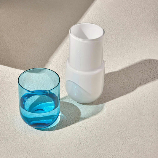 Turquoise water night set with carafe and matching glass.