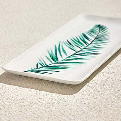RAINFOREST PORCELAIN PLATE with green leaf design on glossy white background.