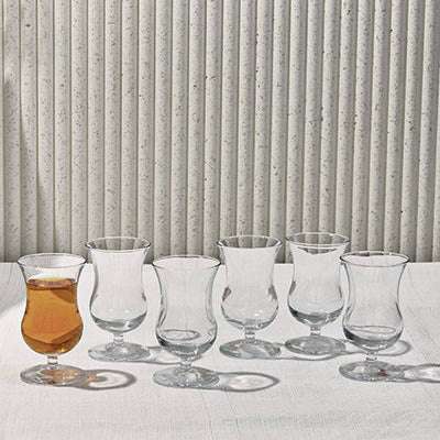 SOCKET THE GLASSElevate your beverage experience with the elegant Socket Glass Set. This collection features gracefully curved glasses, perfect for serving tea, cocktails, or other Glass