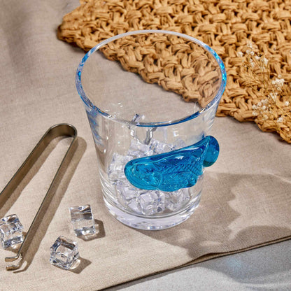 FISH SEALED GLASS - TURQUOISE BLUEElevate your decor with this stunning Sealed Glass Fish in Turquoise Blue. A blend of modern elegance and aquatic charm, it's perfect for adding a unique touch to yoGlass
