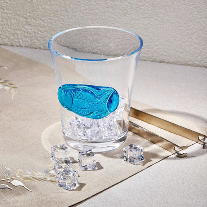 FISH SEALED GLASS - TURQUOISE BLUEElevate your decor with this stunning Sealed Glass Fish in Turquoise Blue. A blend of modern elegance and aquatic charm, it's perfect for adding a unique touch to yoGlass