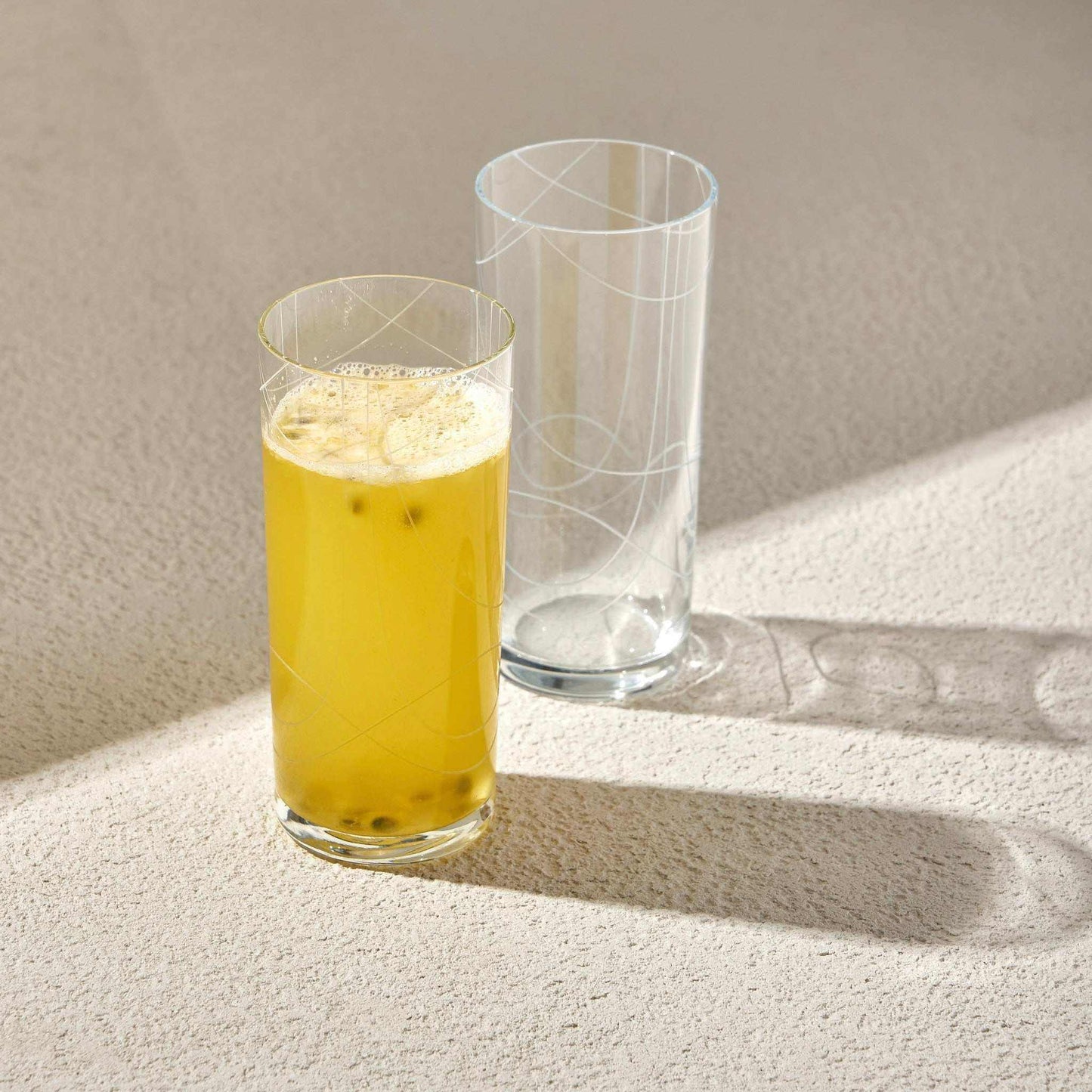 "DOODLE" RAKI GLASSElevate your beverage experience with the elegant Glass Set. This collection features, perfect for serving tea, cocktails, or other beverages in style. The unique deGlass