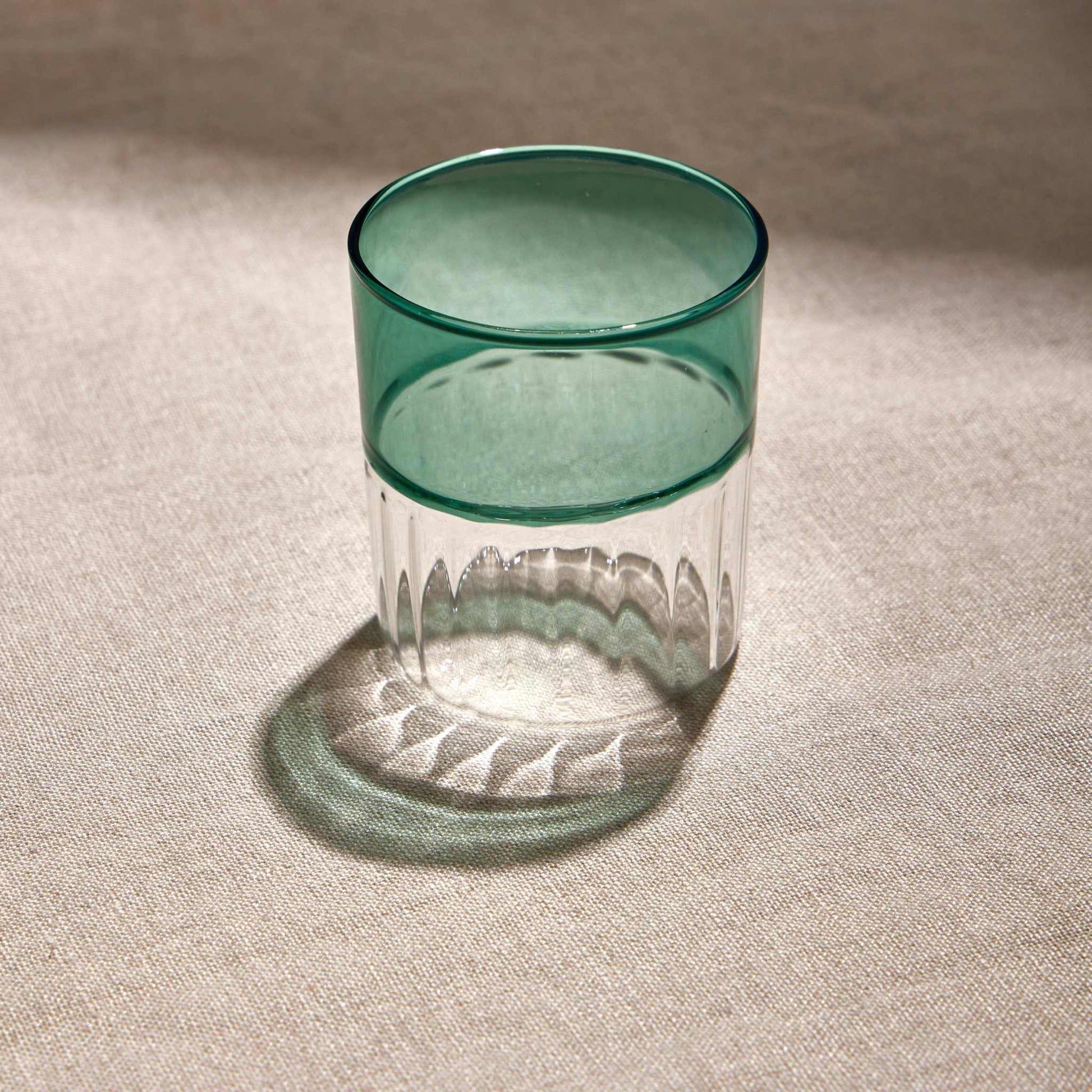 RIPPLES GLASS - GREENAdd a touch of elegance to your drinkware collection with the 200ml Green Ripples Glass Tumbler. Featuring a stunning rippled texture and warm amber hue, it’s perfecGlass