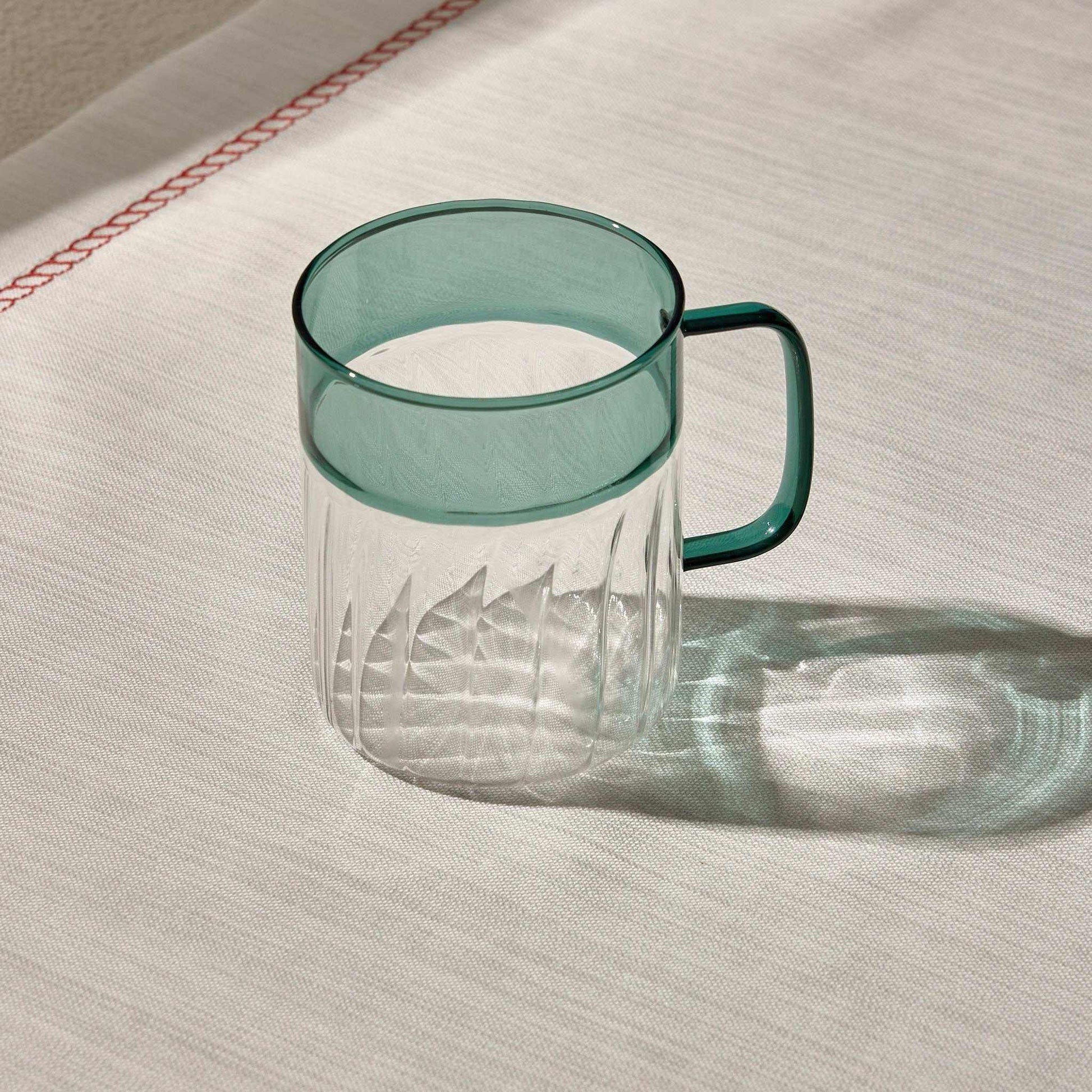 RIPPLES CUP with unique textured design and vibrant hue, ideal for stylish table settings.