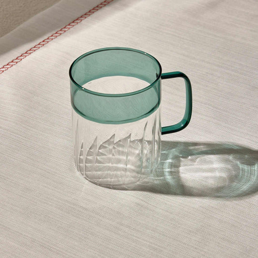 RIPPLES CUP with unique textured design and vibrant hue, ideal for stylish table settings.