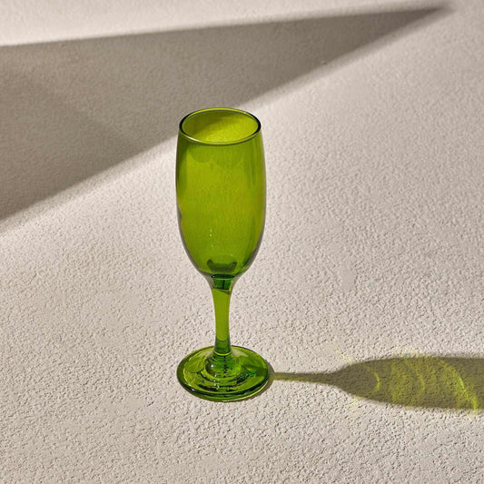 CHAMPAGNE GLASS - GREEN on textured surface.