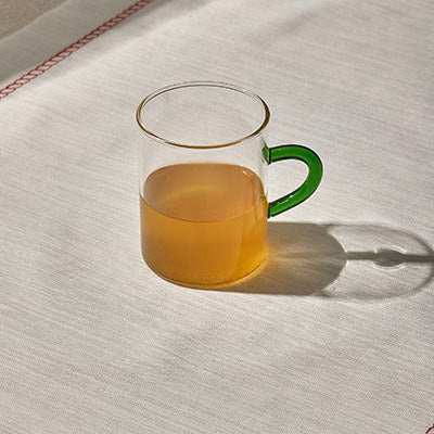 CONTRAST MUG GREENEnhance your drinkware collection with our CONTRAST MUG GREEN. Its unique rippled design and vibrant green handle make it a stylish addition to any table setting.Glass Mug