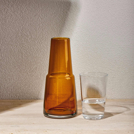 NIGHT WATER SET 750 ML - AMBERElevate your bedside or tabletop with the Amber Night Water Set in a captivating turquoise hue. Designed for both style and function, this sophisticated set includesBottle