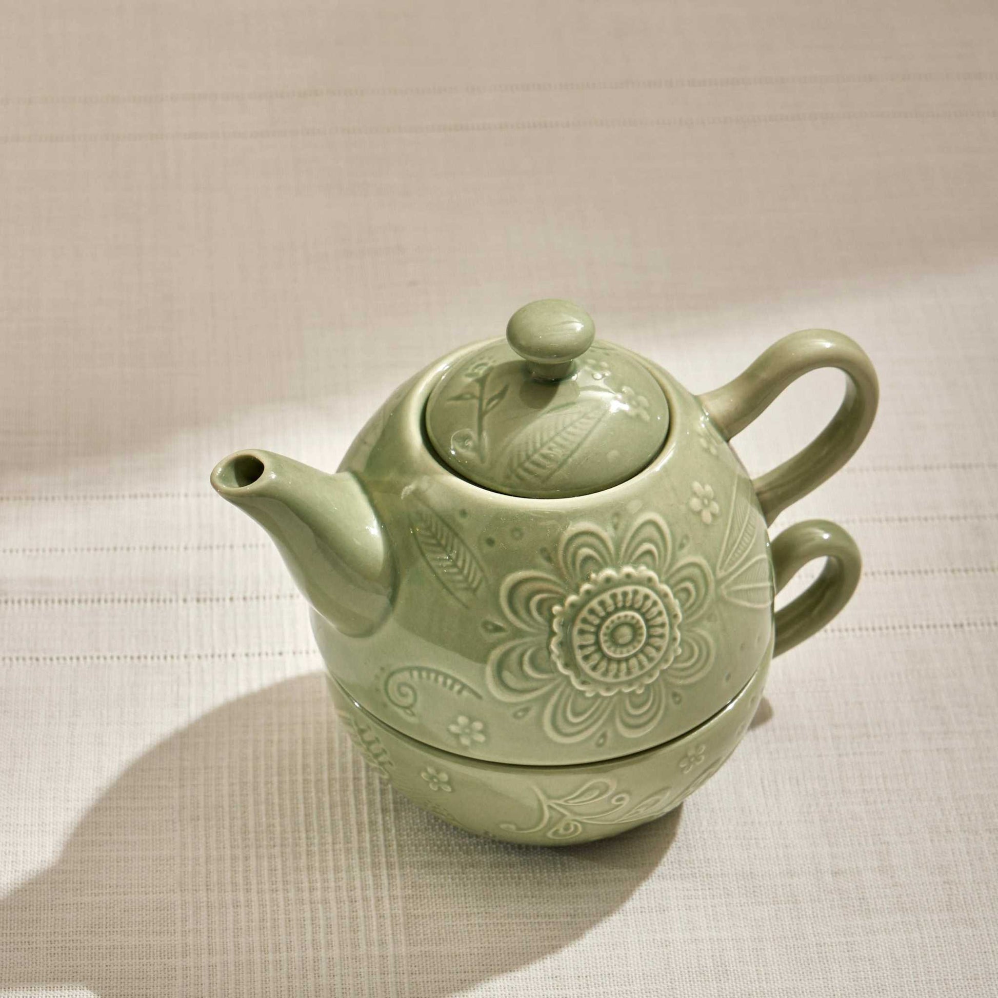 FLORAL POEM TEA POT SET OF 2/350 MLThis is a delicate and charming tea pot set titled "Floral Poem". The set features a soft, pastel green ceramic body adorned with intricate floral and botanical desiTea Pot