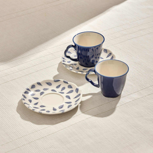 CLOVER LEAF PORCELAIN SET OF 2 COFFEE CUPS 80 ML - WHITE & BLUEThe Clover Leaf Porcelain Set of 2 Coffee Cups is a beautifully crafted duo designed for an elegant coffee experience. Each cup has an 80ml capacity, perfect for enjCUP AND SAUCER