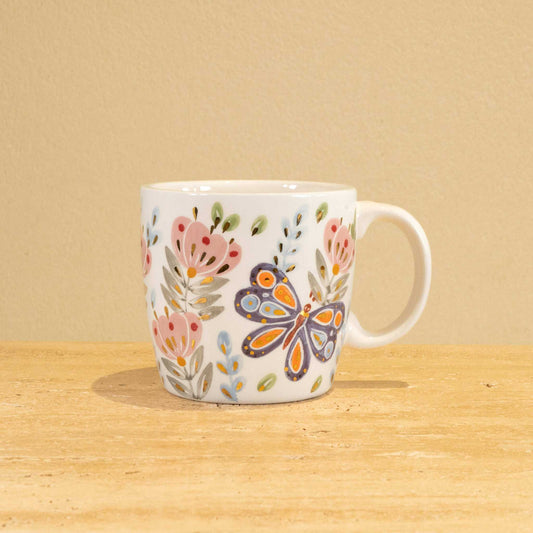 Personalized handmade ceramic mug with gold-plated letter "E" and floral design.