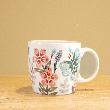 Personalized handmade ceramic mug with gold-plated letters "SH" and floral design.