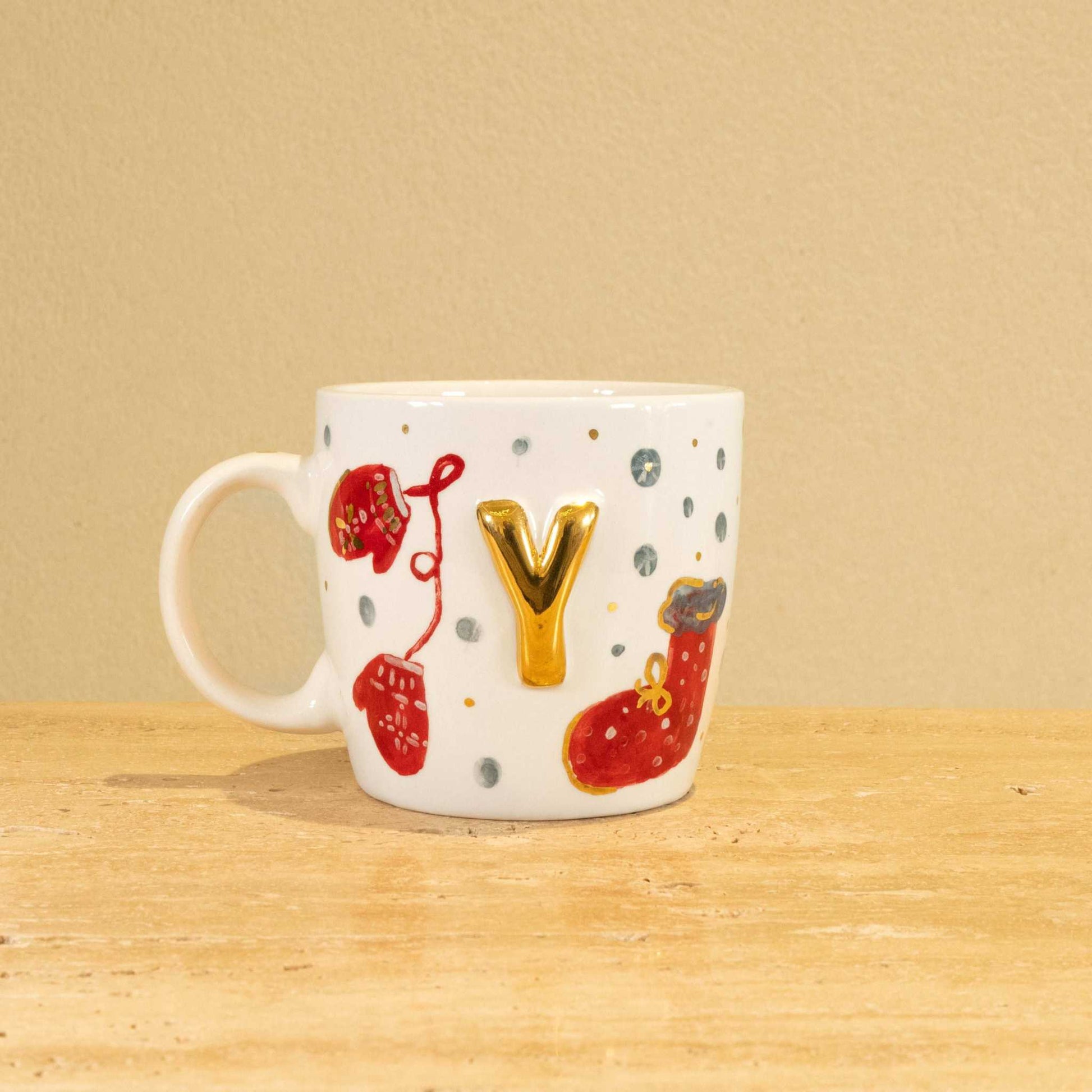 Personalized handmade ceramic mug with gold-plated letter Y and floral design.