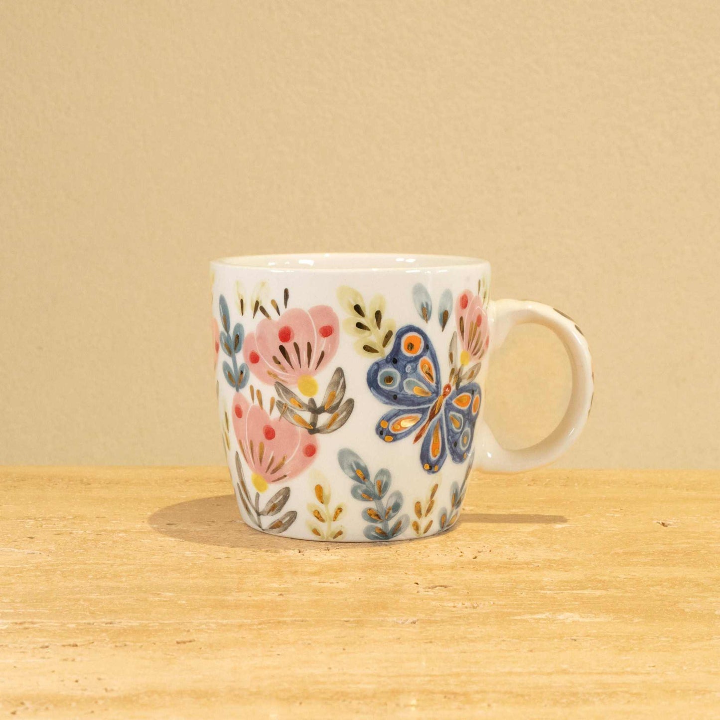 Custom handmade ceramic mug with gold-plated "Z" and floral design.