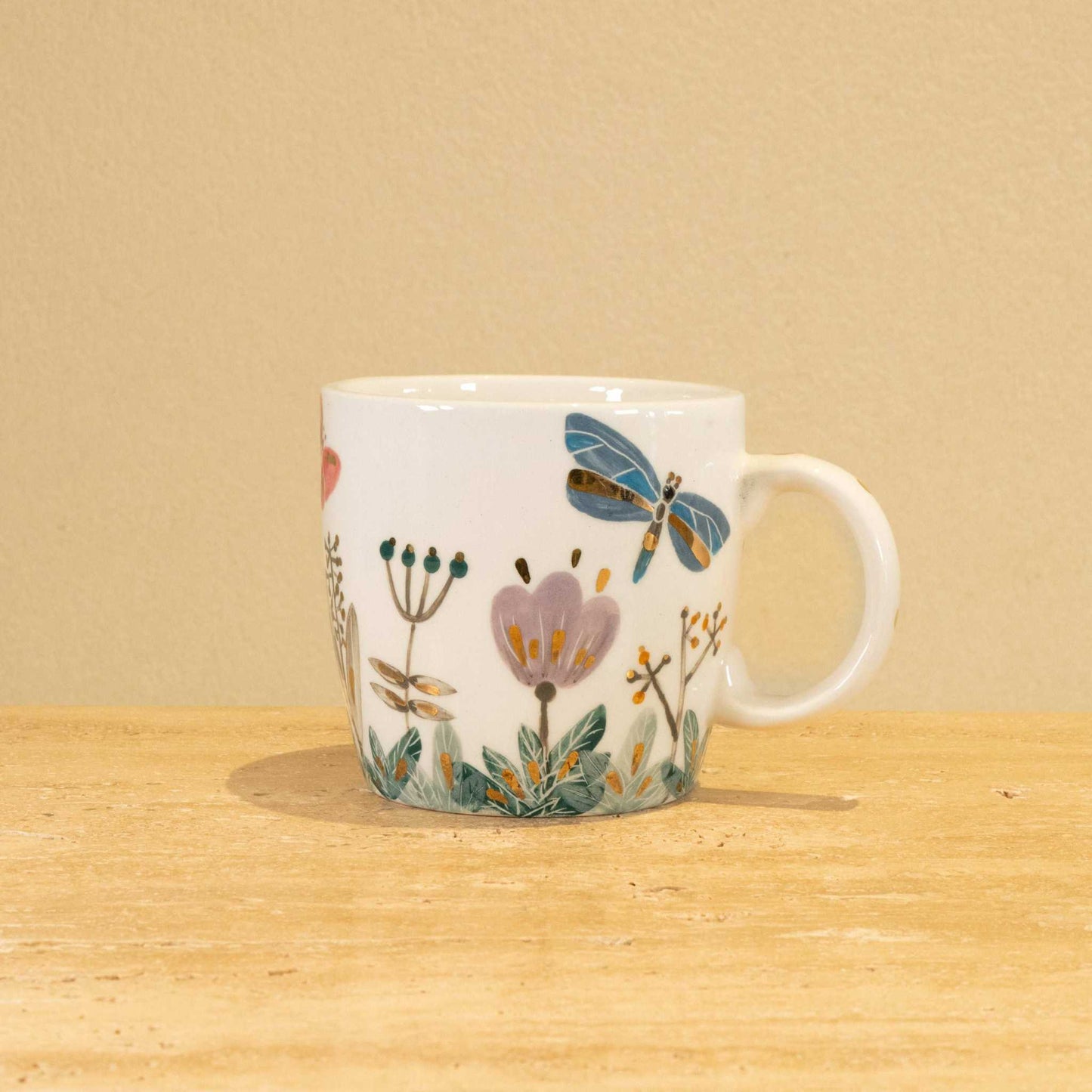 Custom handmade ceramic mug with gold-plated initial "Z" and floral design.