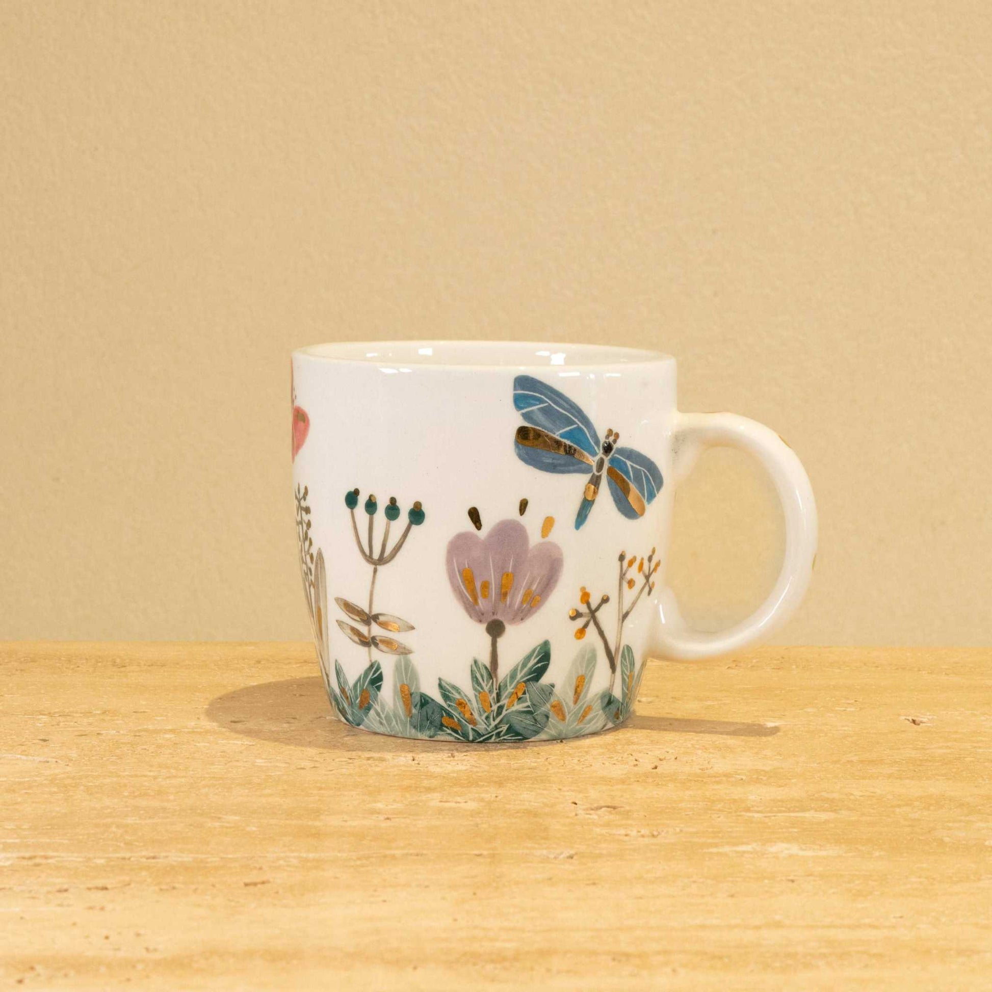 Custom handmade ceramic mug with gold-plated initial "Z" and floral design.