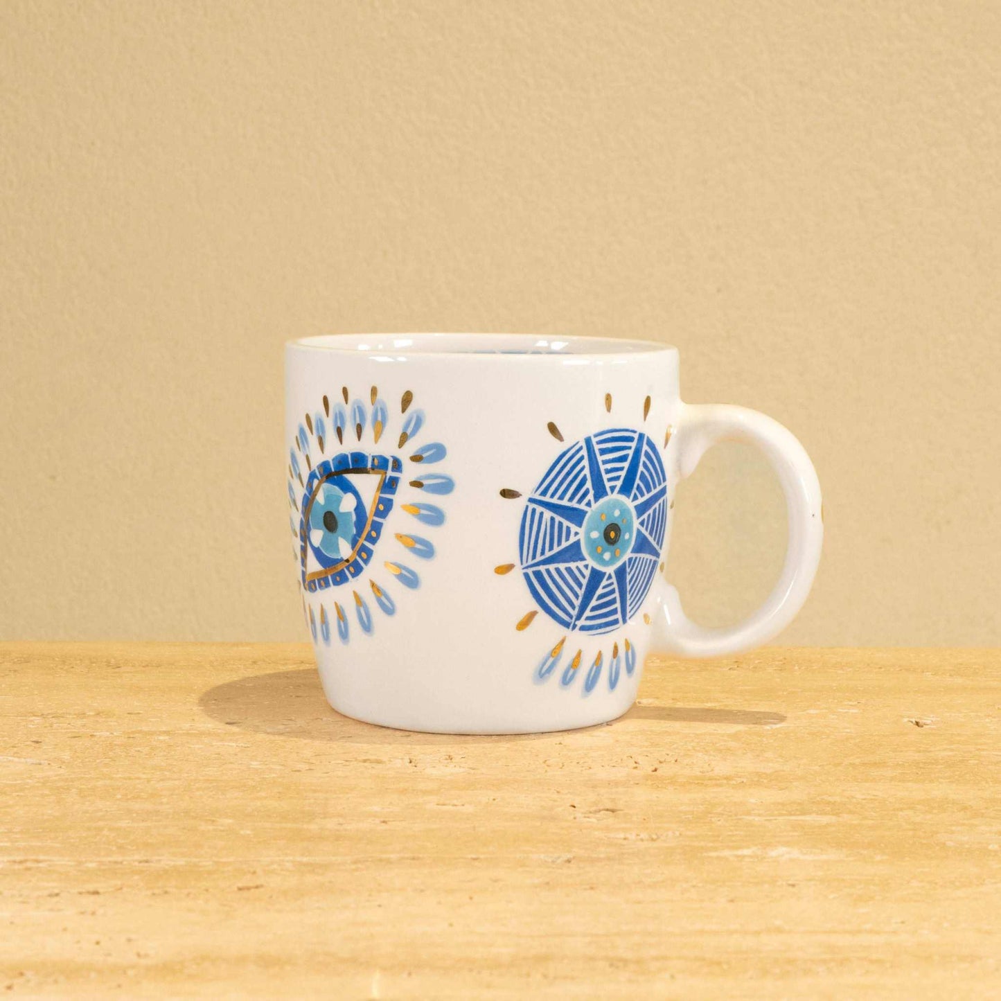 Custom handmade ceramic mug with gold-plated initial "A" and floral design.
