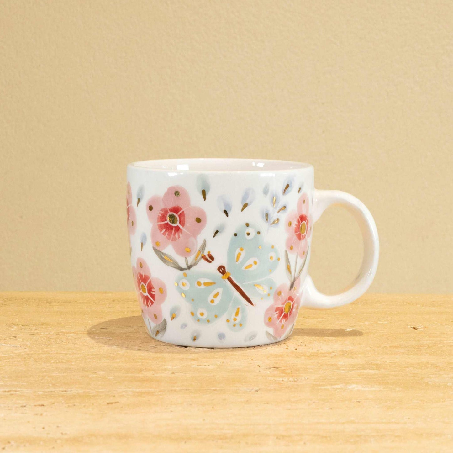 Custom handmade ceramic mug with gold-plated initial "B" and floral design.