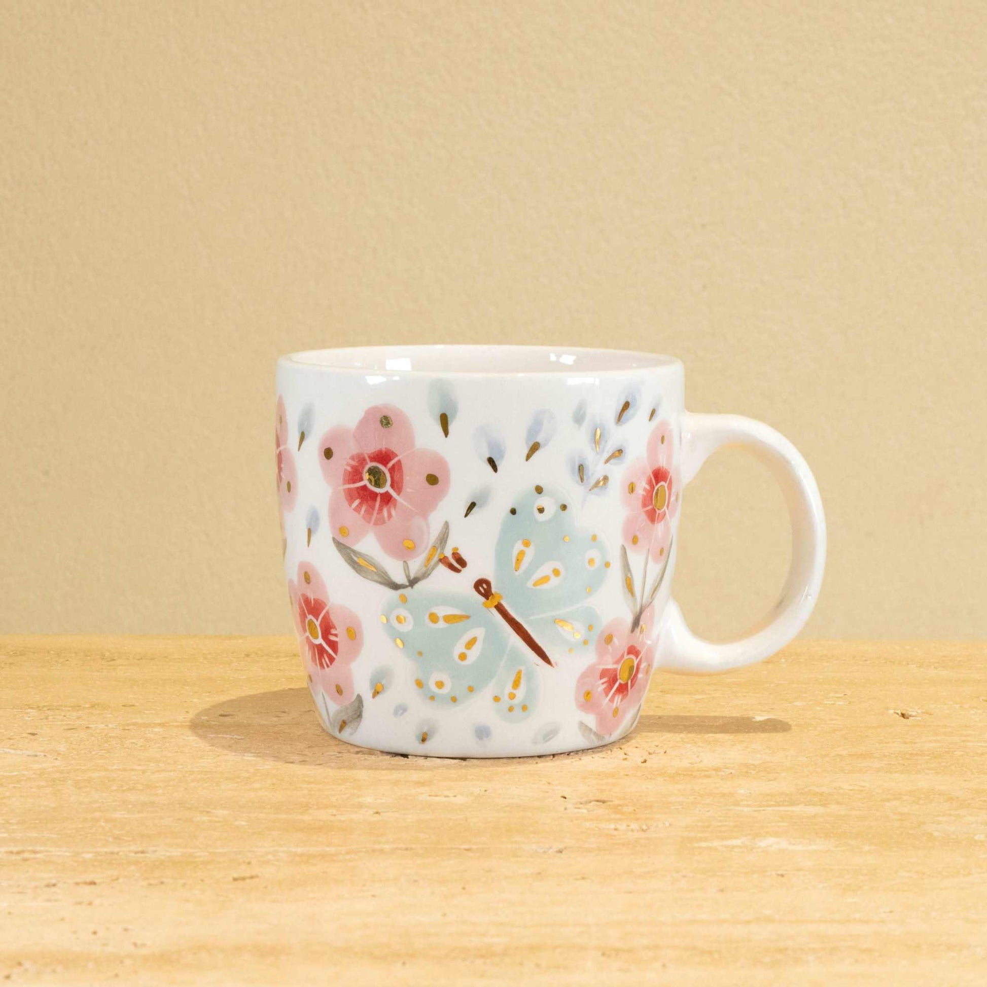Custom handmade ceramic mug with gold-plated initial "B" and floral design.