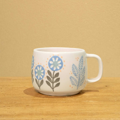 Personalized ceramic mug with gold Arabic monogram "Best Son in the World" and floral design.