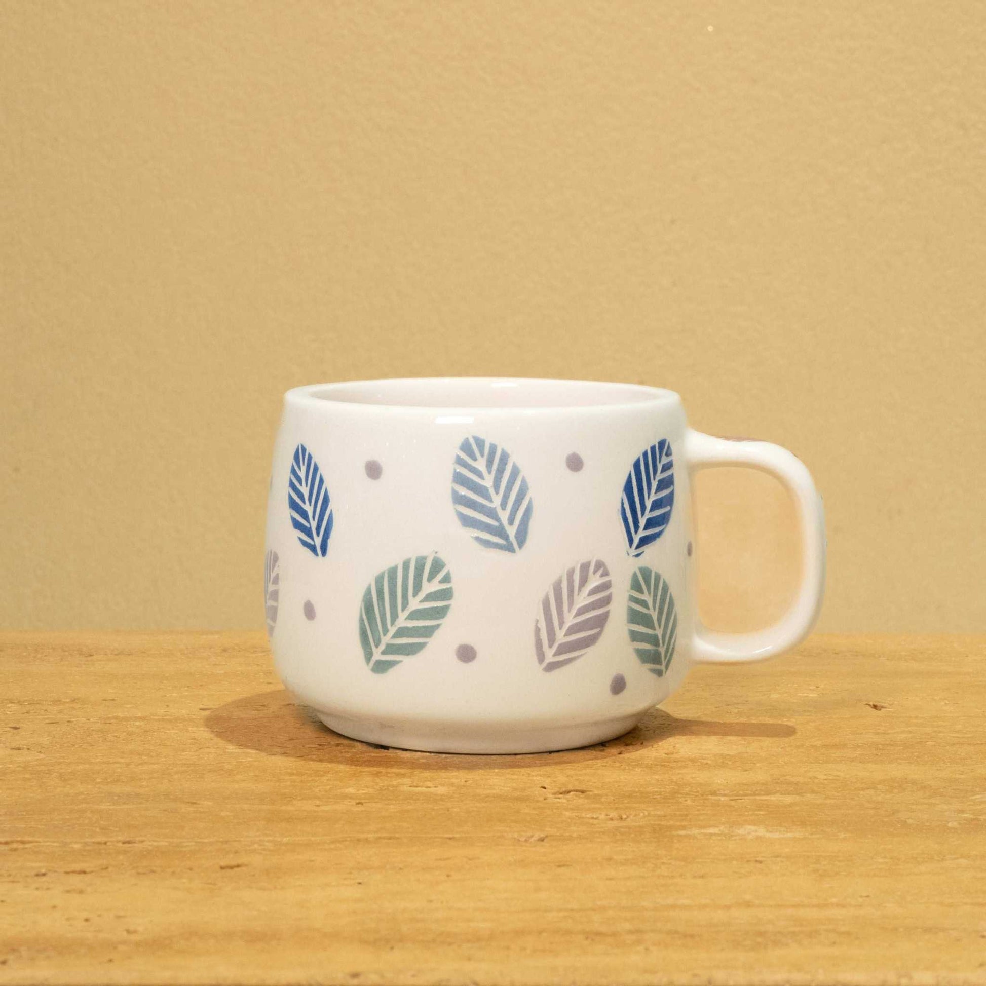 Exquisite handmade ceramic mug with gold Arabic monogram "Best Dad in the World" and vibrant floral design.