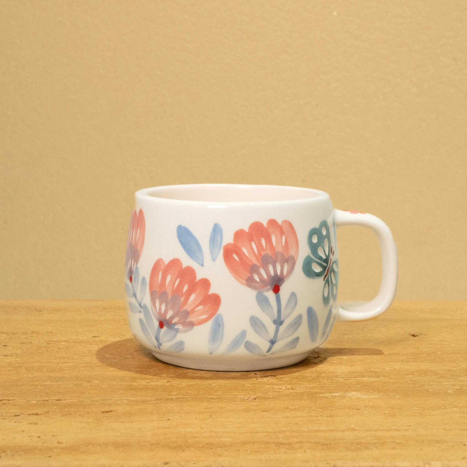 Best Mother In The World Ceramic mug with gold Arabic monogram and floral design.