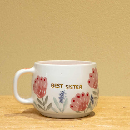 Handmade gold plated cup with "Best Sister" message and floral design.