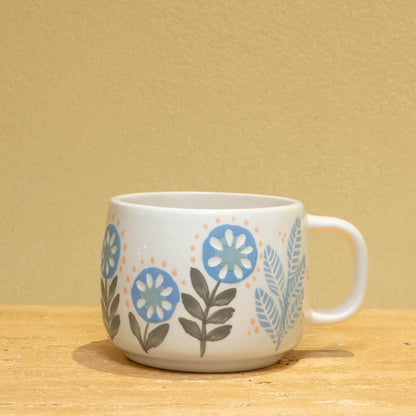 Personalized gold monogram ceramic mug with floral design, featuring "BEST BROTHER" inscription.