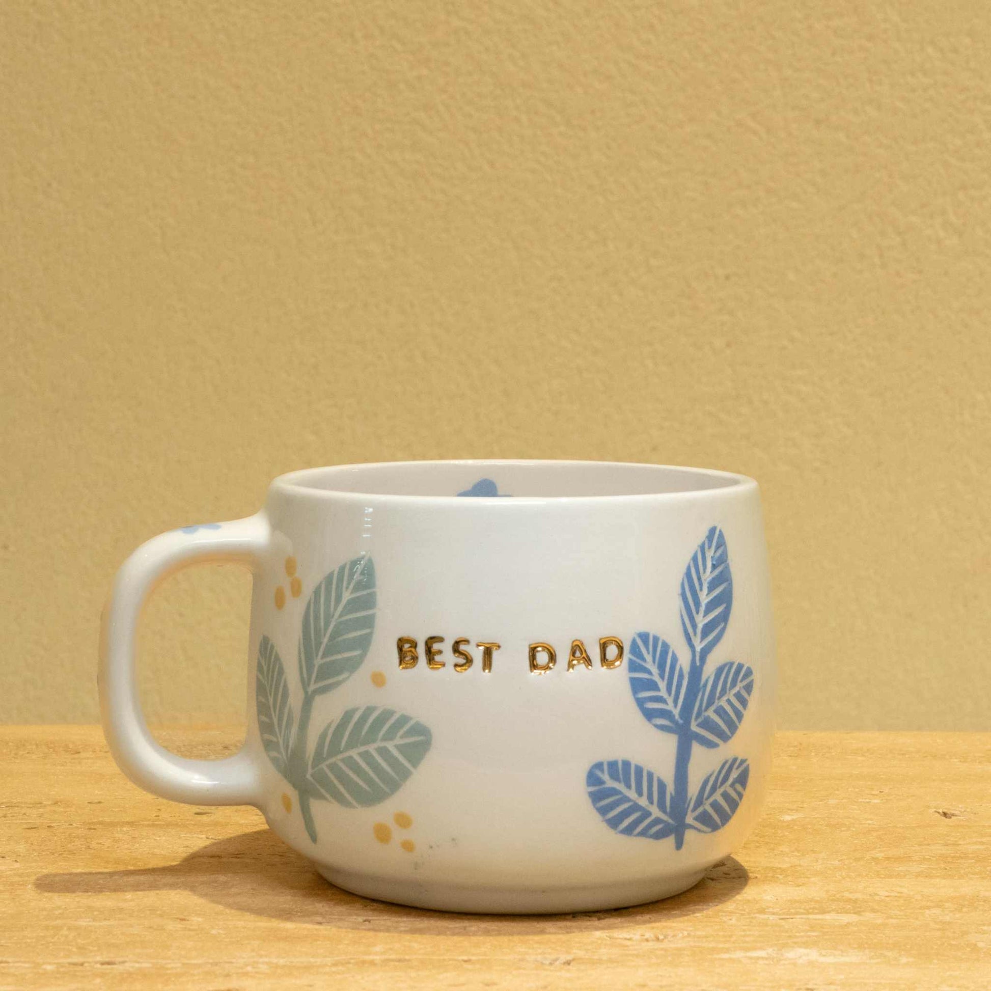 Best Dad - Personalized  gold monogram ceramic mug with "BEST DAD" lettering and floral design.