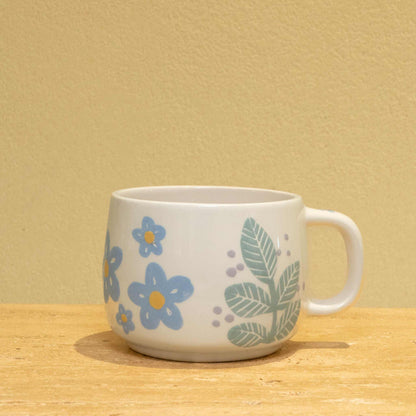Personalized ceramic mug with gold "BEST MOTHER" and floral design.