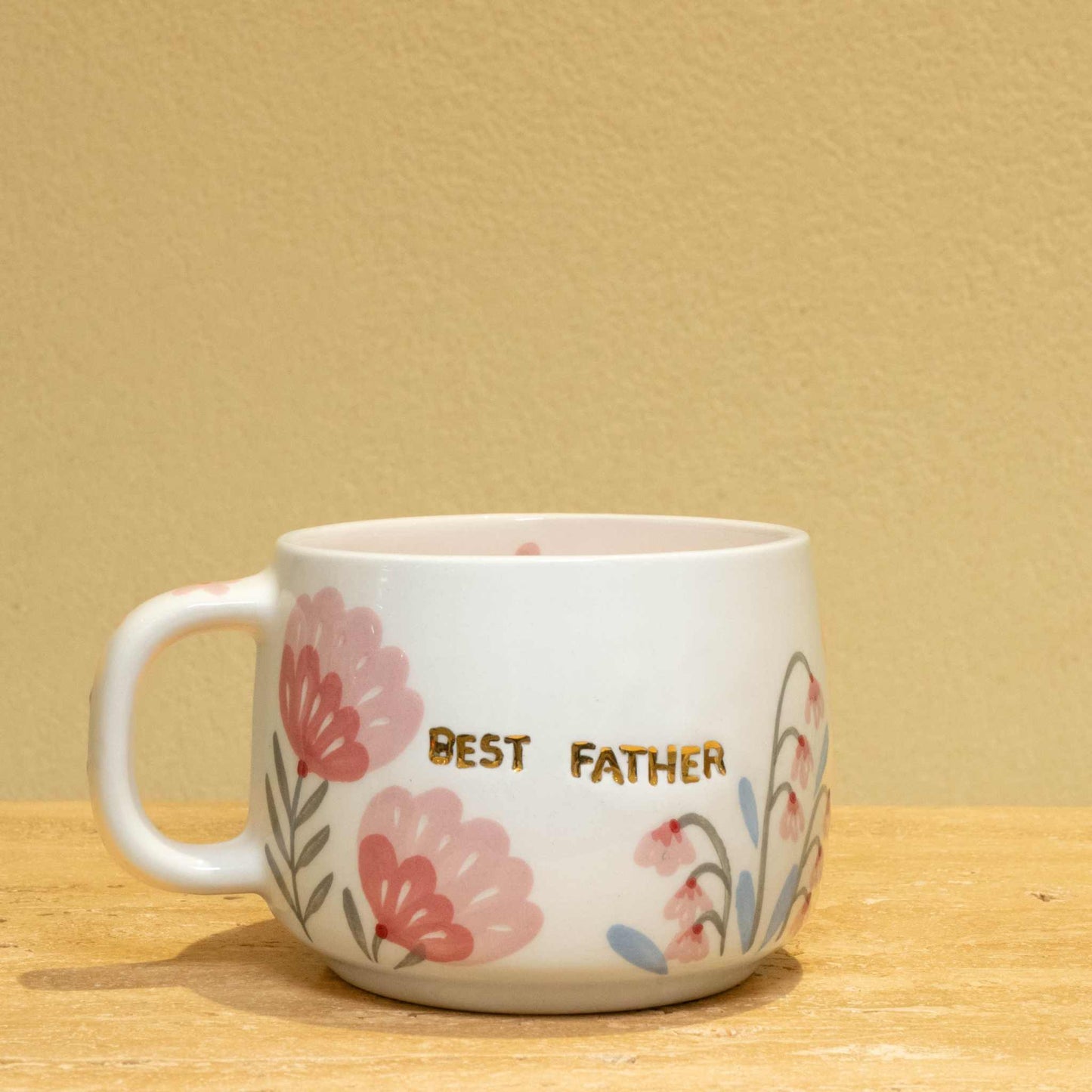 Best Father personalized gold monogram ceramic mug with floral design.
