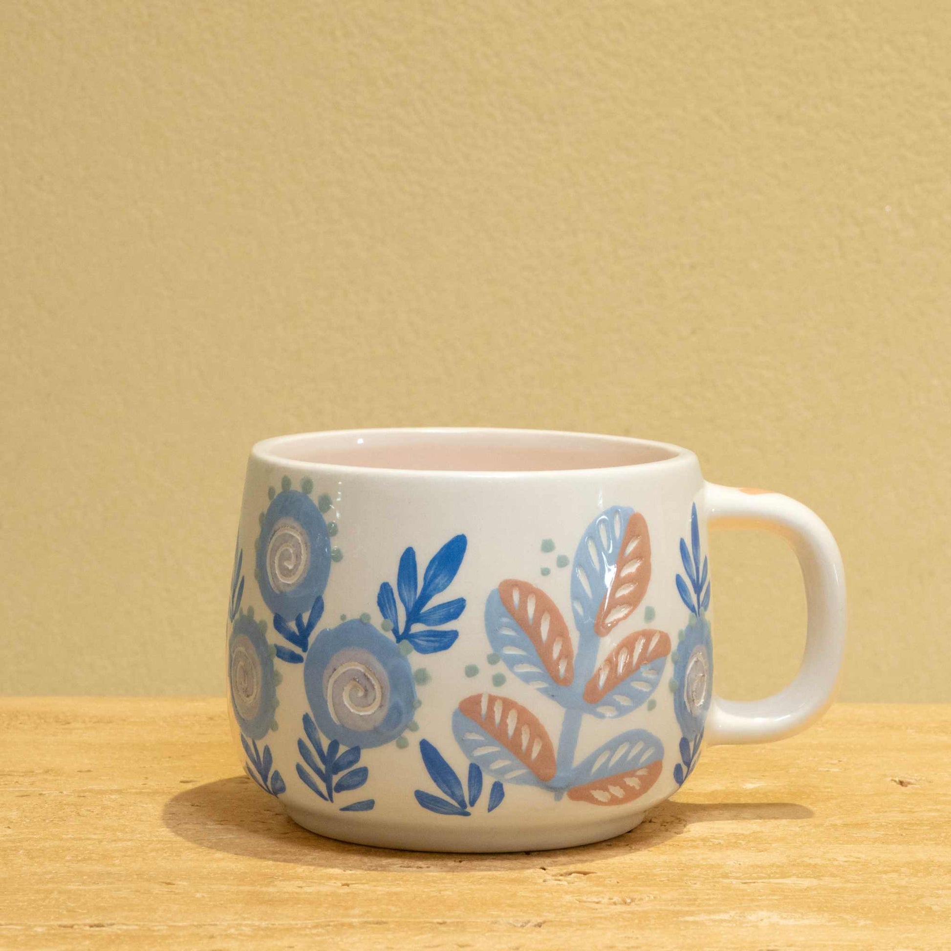 Personalized gold monogram ceramic mug with "Best Father" and floral design.