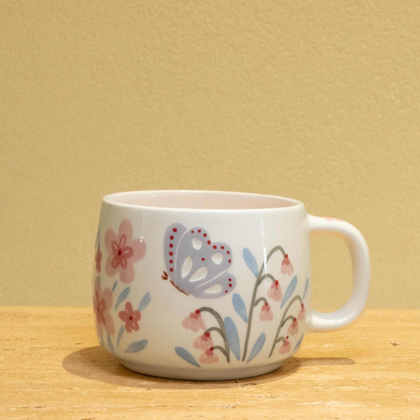 Personalized ceramic mug with "BEST FATHER" gold monogram and floral design.