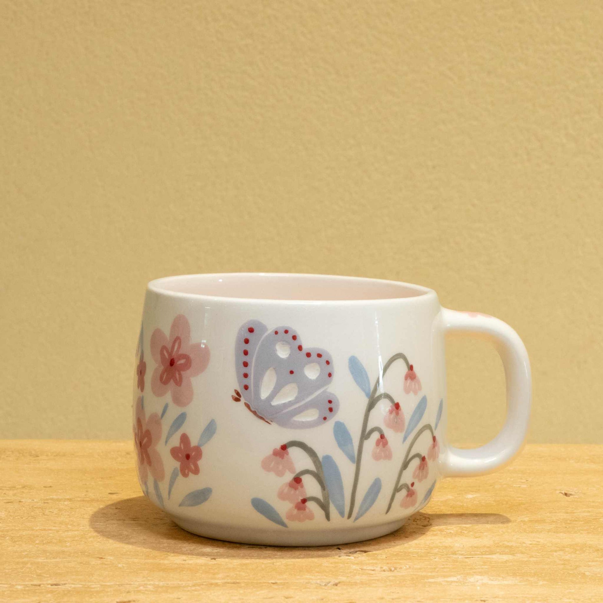 Personalized ceramic mug with "BEST FATHER" gold monogram and floral design.