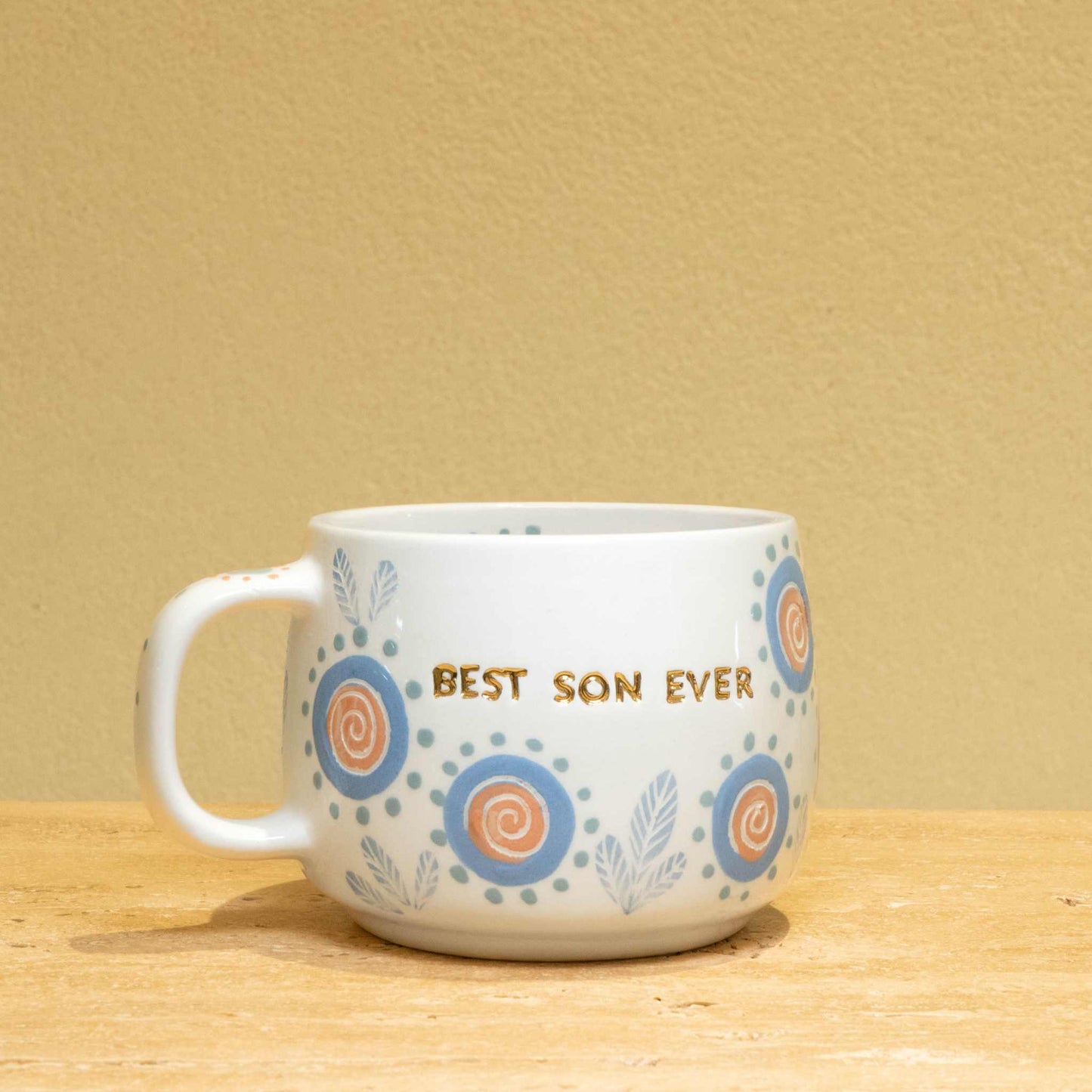 Best Son Ever personalized gold monogram ceramic mug with floral design.