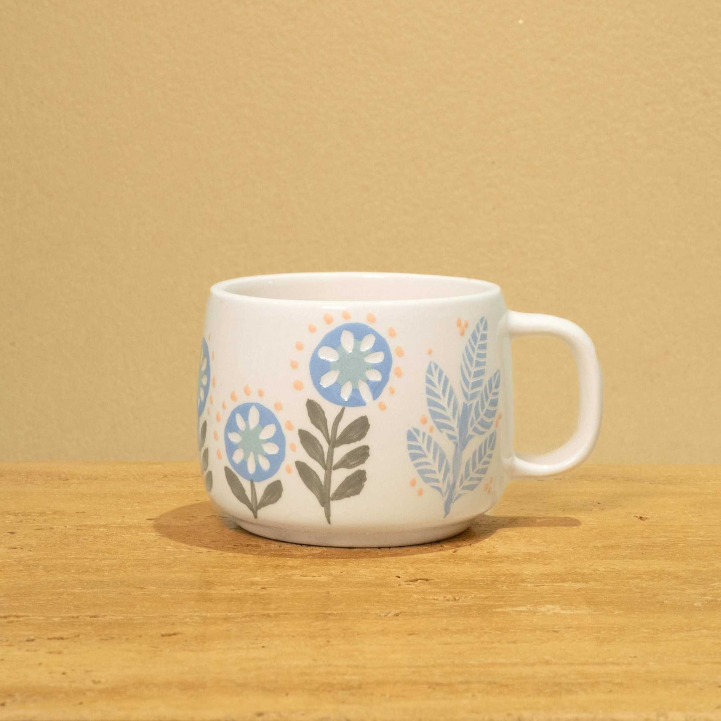 Personalized gold Arabic monogram ceramic mug with floral design, perfect gift for best male friend.