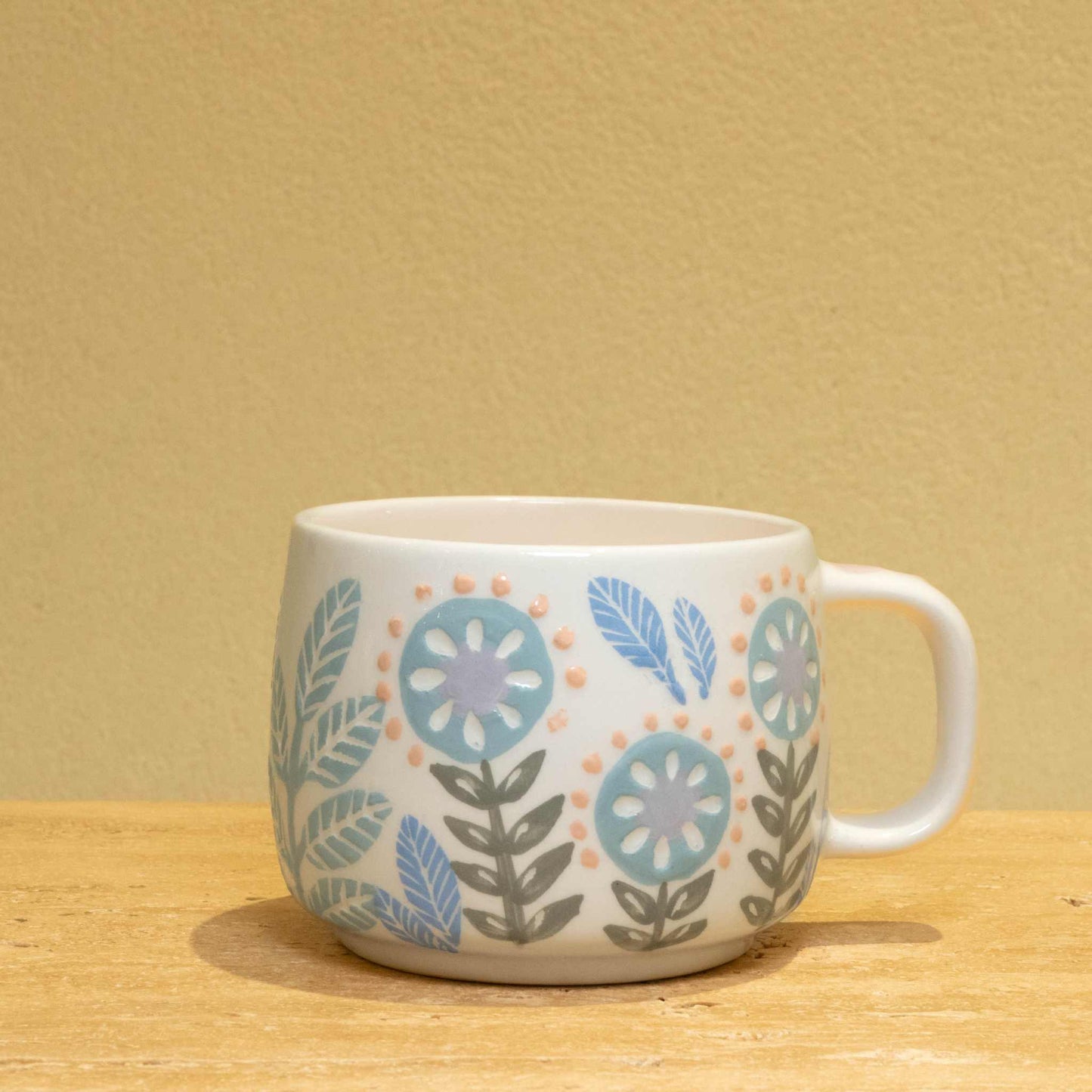 Personalized gold monogram ceramic mug with floral design and "Best Friend Ever" lettering.