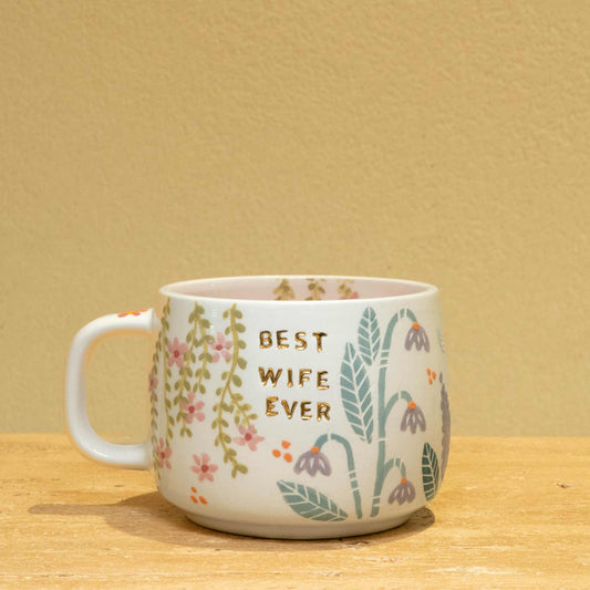 Personalized ceramic mug with gold "BEST WIFE EVER" and floral design.