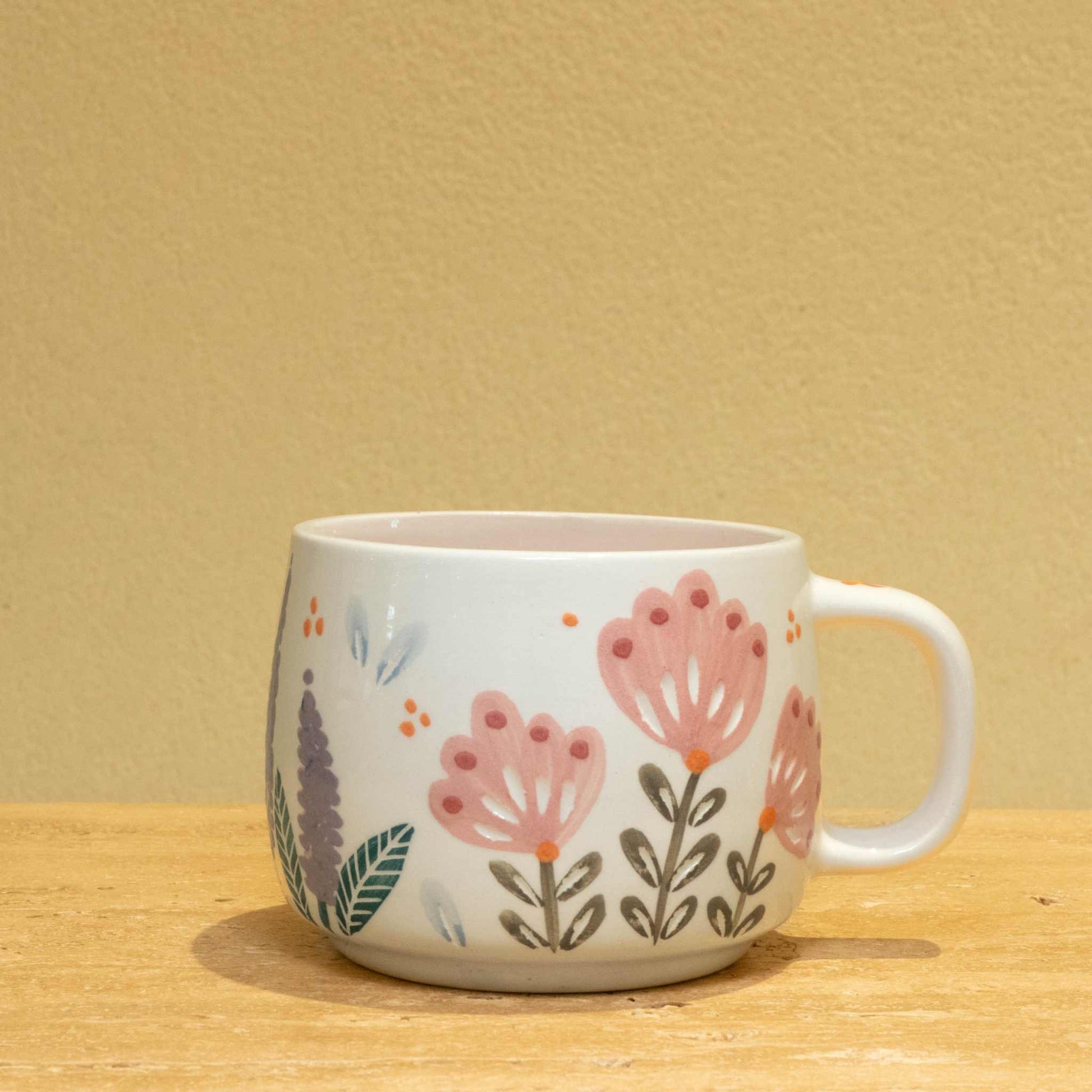 Best Wife Ever ceramic mug with gold accents and floral design.