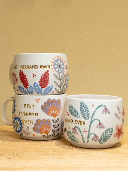 Personalized ceramic mug with "Best Husband Ever" in gold and floral design.