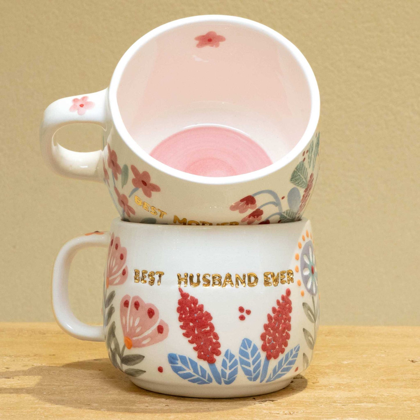 Personalized gold monogram ceramic mug with floral design and "Best Husband Ever" text.