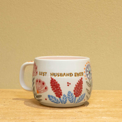 Best Husband Ever ceramic mug with gold monogram and floral design.