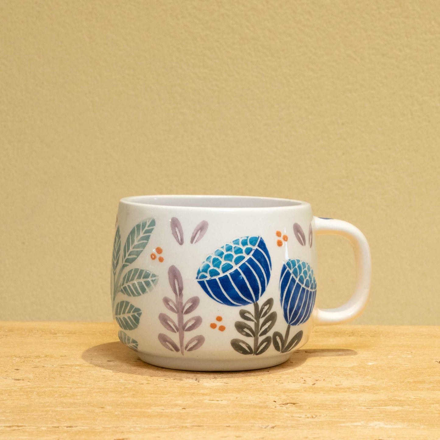 Ceramic mug with gold "BEST HUSBAND EVER" monogram and floral design.