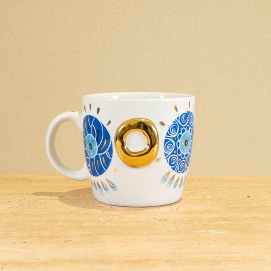 Custom handmade ceramic mug with gold-plated initial "O" and floral design.