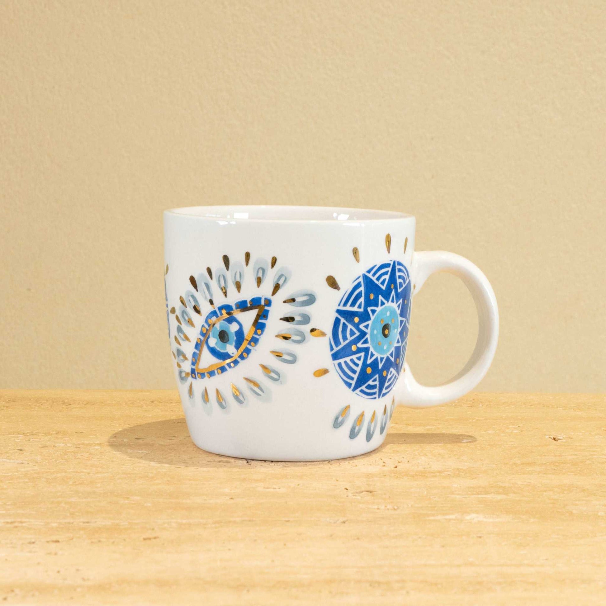 Custom handmade ceramic mug with intricate floral design and gold-plated initial "O".