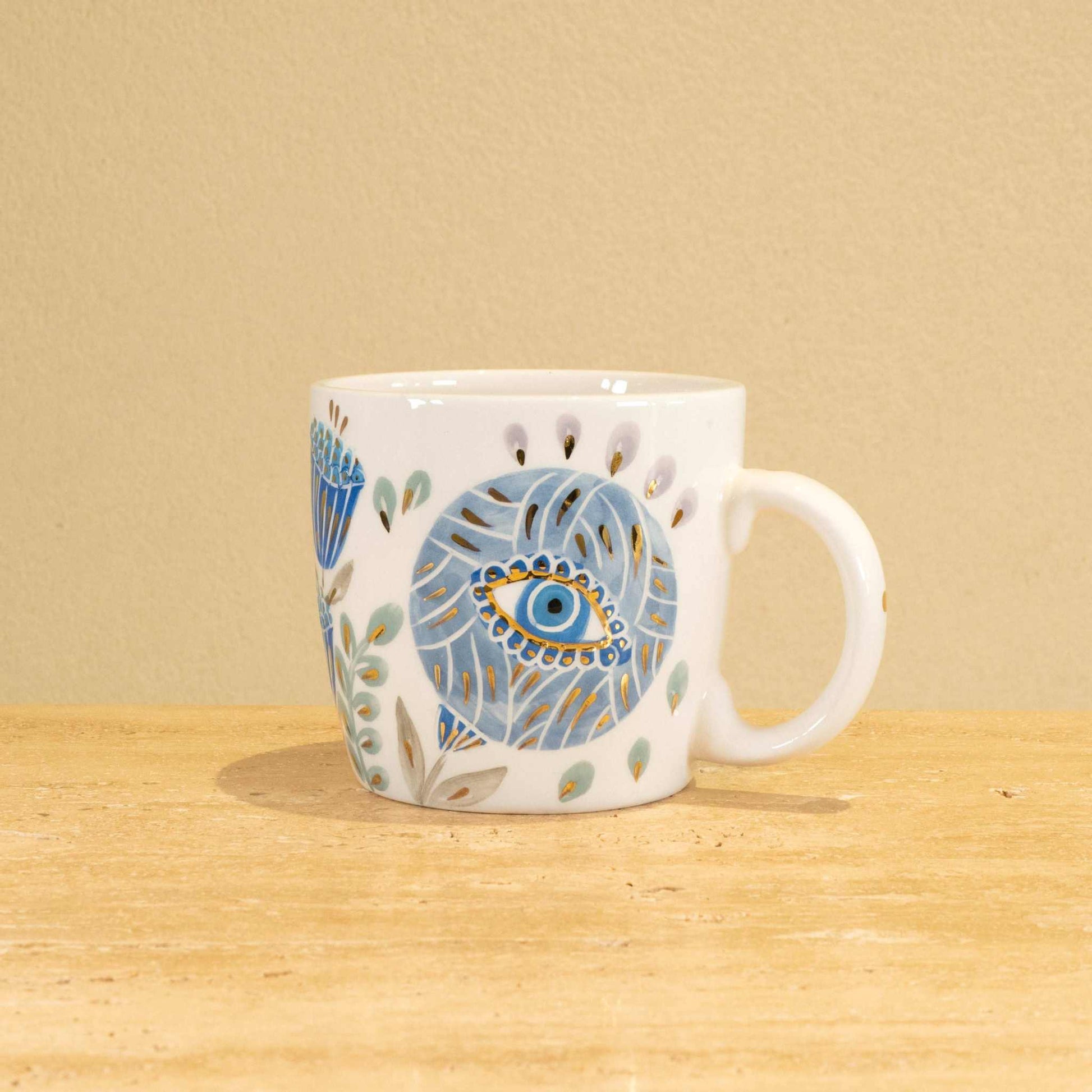 Custom handmade ceramic mug with gold-plated initial "P" and floral design.