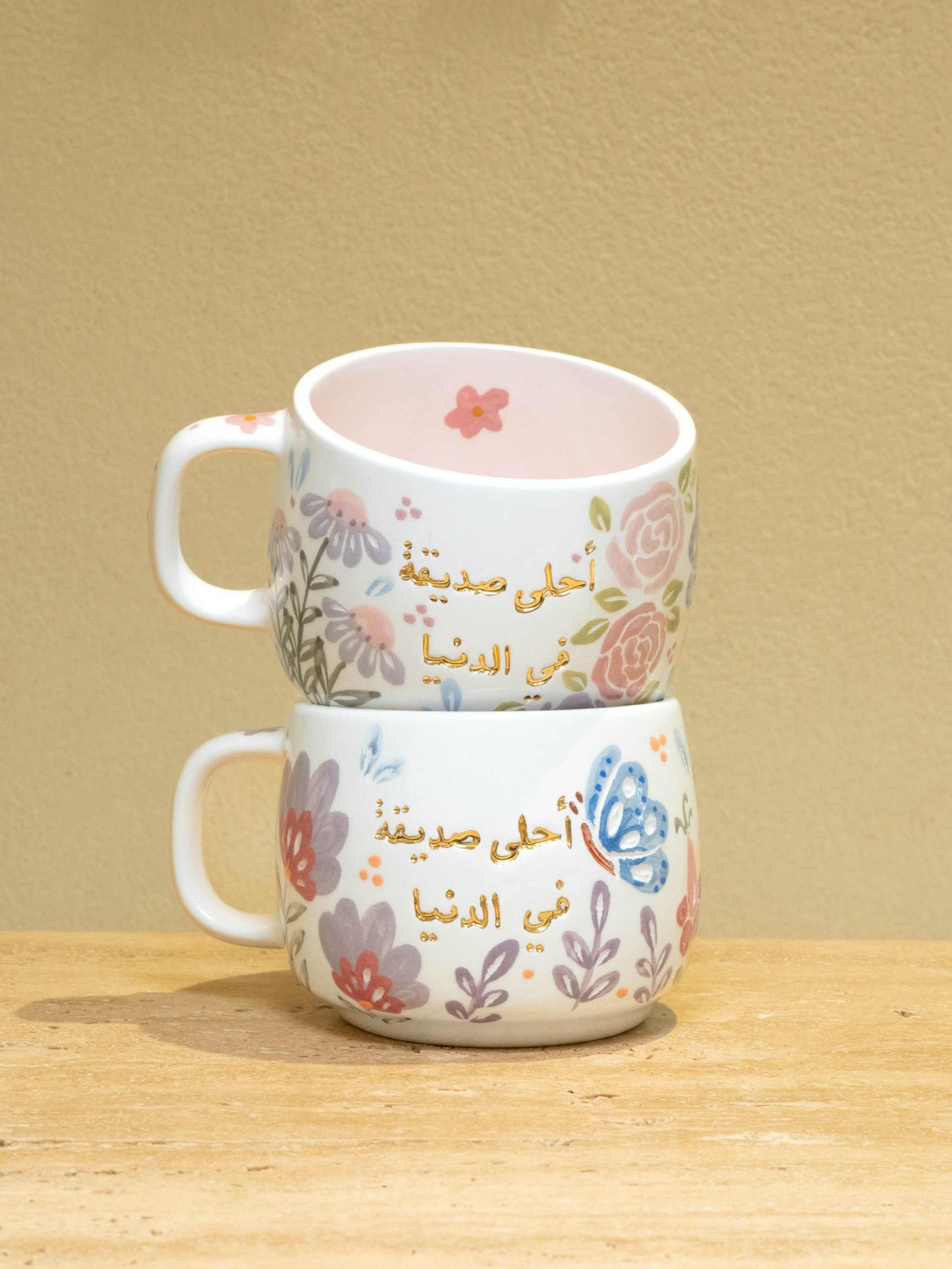 Personalized ceramic mug with gold Arabic monogram "Best Female Friend" and floral design.