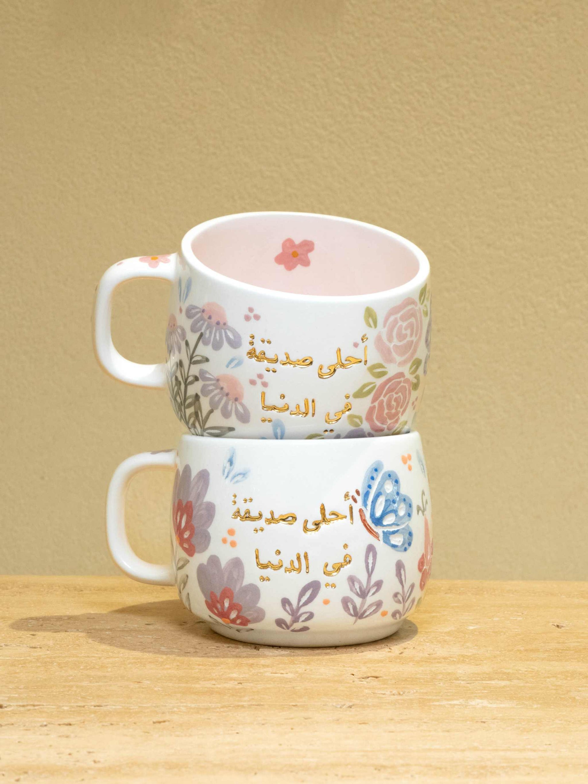 Personalized ceramic mug with gold Arabic monogram "Best Female Friend" and floral design.